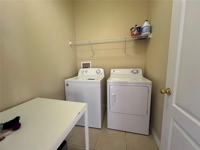 10791 Gran Paradiso Dr Unit S, Orlando, FL 32832 - laundry room with independent washer and dryer and light tile patterned floors