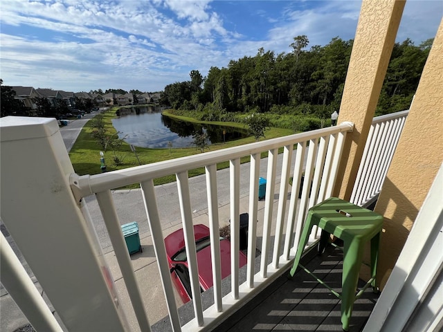 balcony featuring a water view