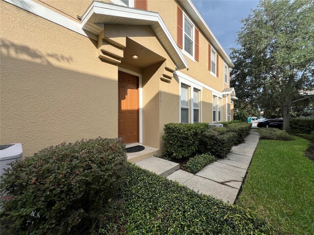 10791 Gran Paradiso Dr Unit S, Orlando, FL 32832 - property entrance with stucco siding