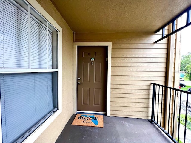 entrance to property with a balcony