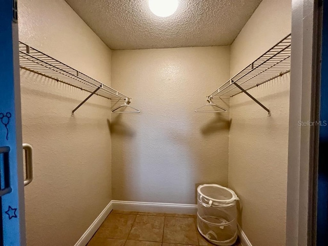 walk in closet featuring tile patterned floors