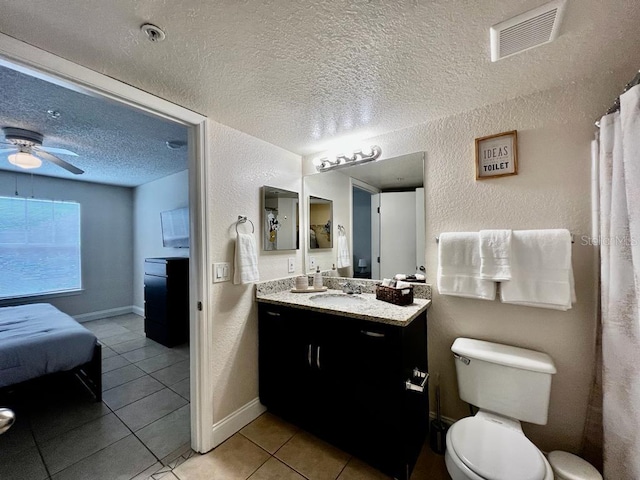 2210 Grand Cayman Ct Unit 1722, Kissimmee, FL 34741 - bathroom with vanity, a textured ceiling, tile patterned flooring, ceiling fan, and a textured wall