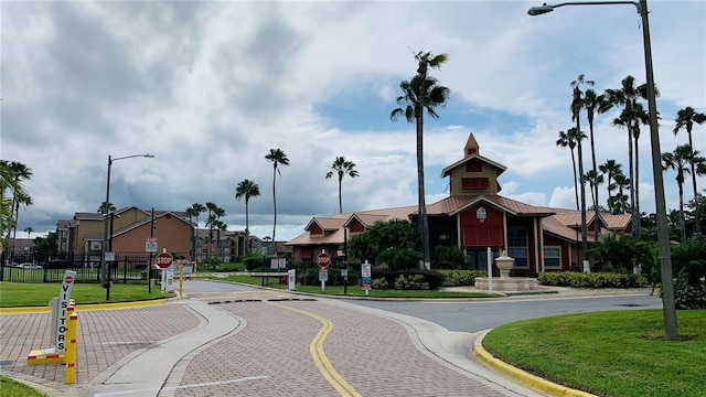 2210 Grand Cayman Ct Unit 1722, Kissimmee, FL 34741 - view of asphalt street with traffic signs, curbs, street lights, and a residential view