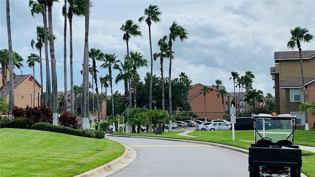 view of property's community featuring a lawn