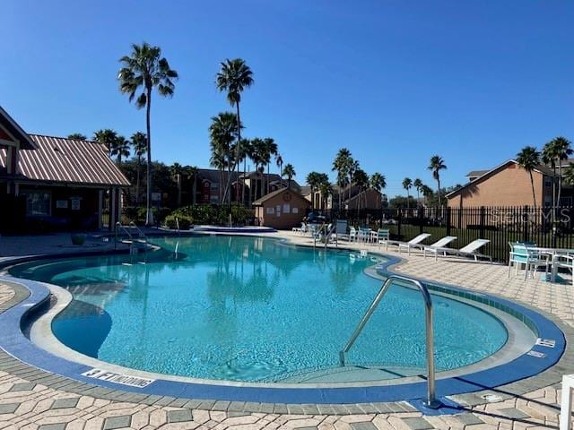 view of swimming pool featuring a patio area