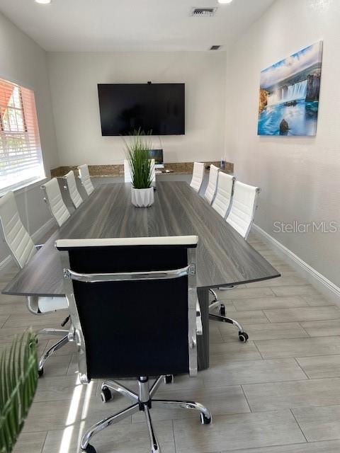 dining space with light hardwood / wood-style floors