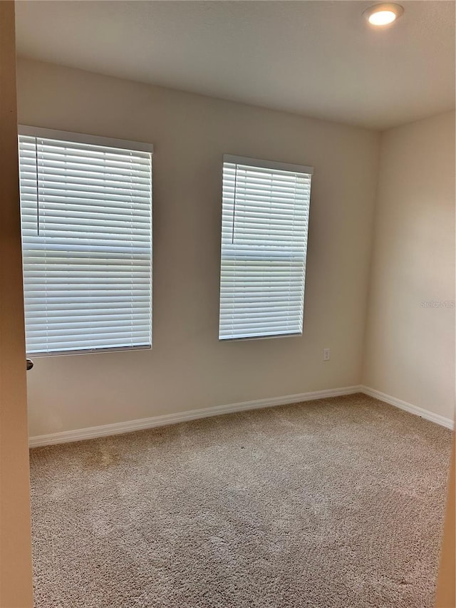 spare room with carpet flooring