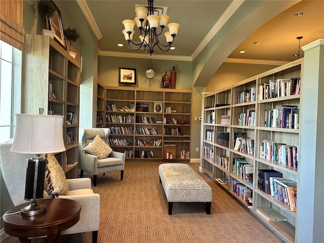 living area with crown molding, a chandelier, and carpet flooring