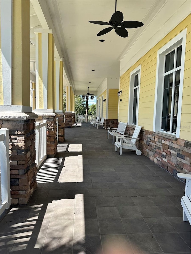 view of patio featuring ceiling fan