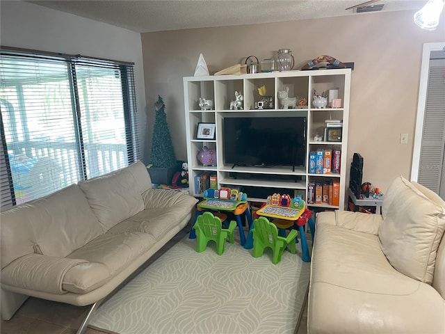 living room featuring a textured ceiling