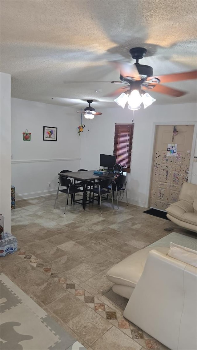 dining room featuring a textured ceiling