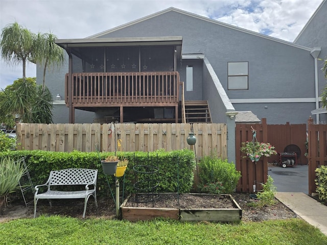 back of house with a sunroom