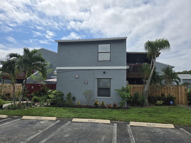 rear view of house with a yard