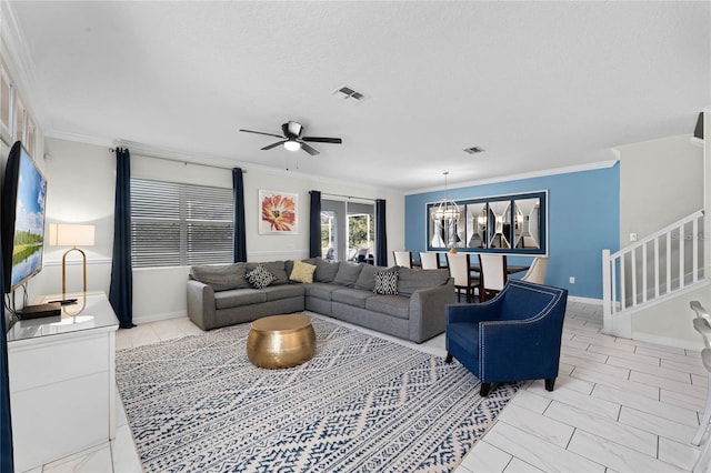 living room with ceiling fan with notable chandelier, crown molding, and a textured ceiling