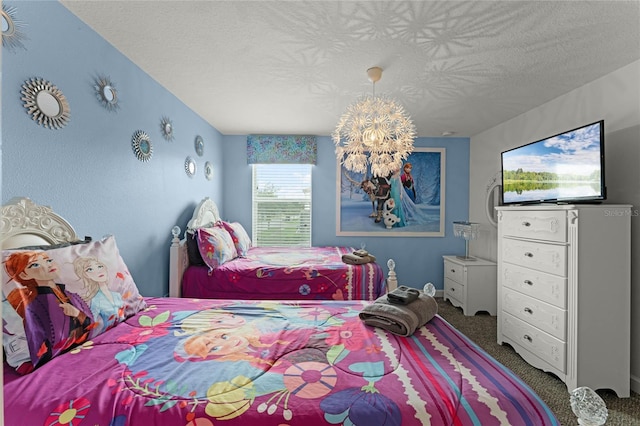 carpeted bedroom with a chandelier and a textured ceiling