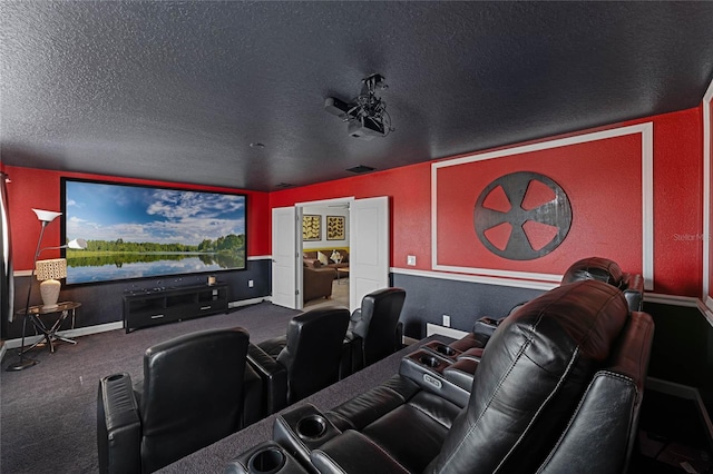 home theater with carpet floors and a textured ceiling