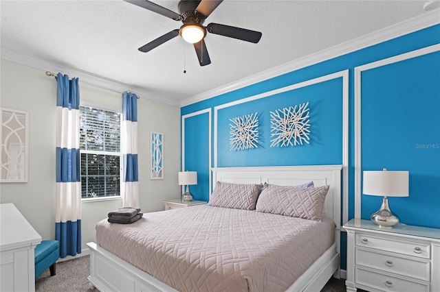 bedroom with ceiling fan, light colored carpet, a textured ceiling, and crown molding