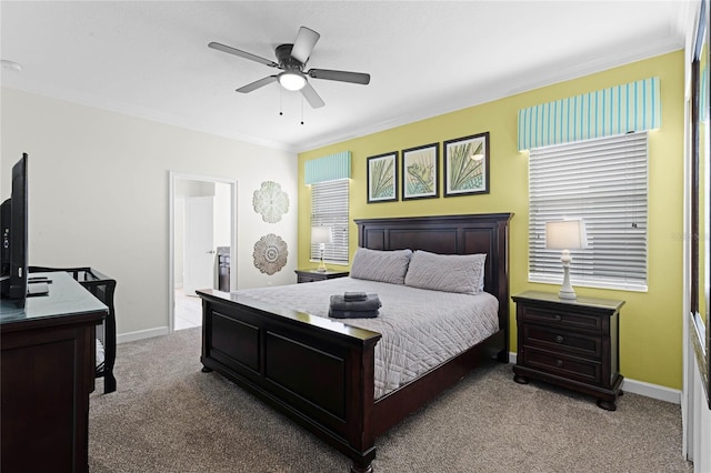 carpeted bedroom with ceiling fan, crown molding, connected bathroom, and multiple windows