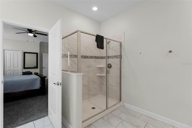 bathroom featuring an enclosed shower and ceiling fan