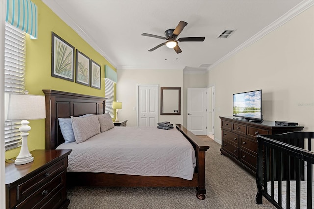 bedroom with a closet, crown molding, light colored carpet, and ceiling fan