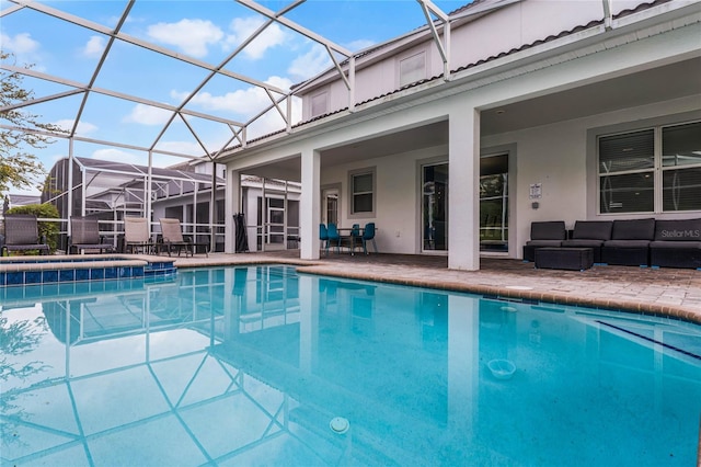 view of pool with an outdoor hangout area, a patio area, and a lanai