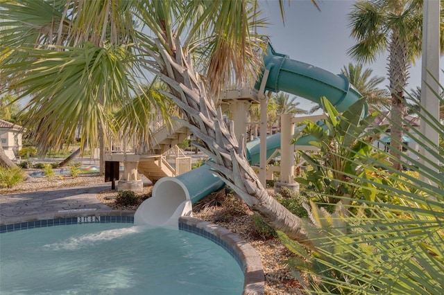 view of pool with a water slide