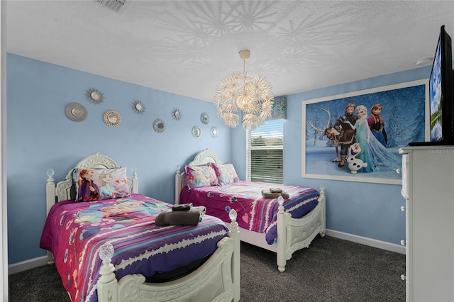 carpeted bedroom featuring a textured ceiling and a notable chandelier