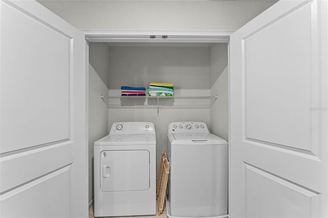 washroom featuring independent washer and dryer