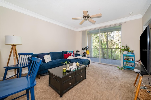 carpeted living room with ceiling fan and ornamental molding