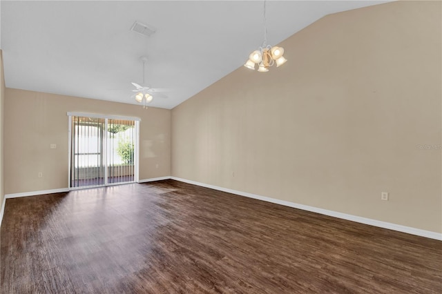 spare room featuring vaulted ceiling, ceiling fan with notable chandelier, and dark hardwood / wood-style flooring