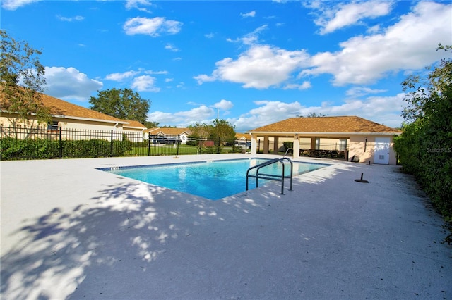 view of swimming pool featuring a patio area