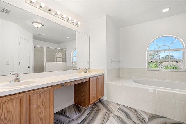 bathroom with vanity and plus walk in shower