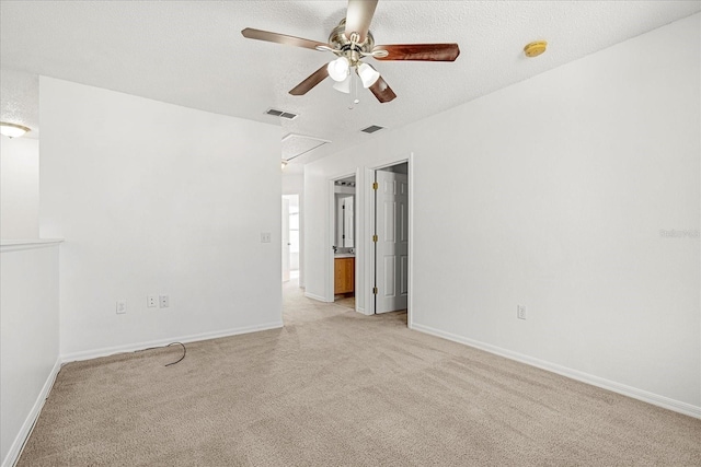 spare room featuring ceiling fan and a textured ceiling