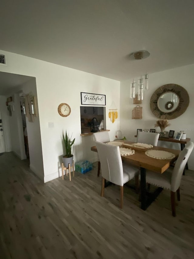 dining room featuring hardwood / wood-style flooring