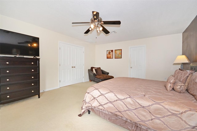 carpeted bedroom with ceiling fan