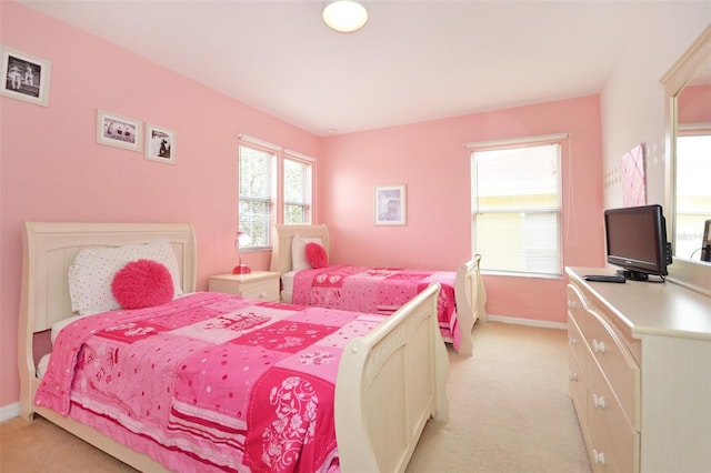 bedroom featuring light carpet