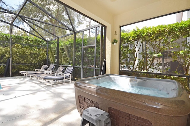 unfurnished sunroom with a hot tub