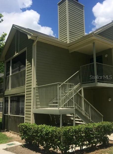 view of home's exterior with a balcony