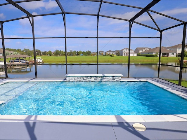 view of swimming pool featuring a lanai, a water view, and pool water feature