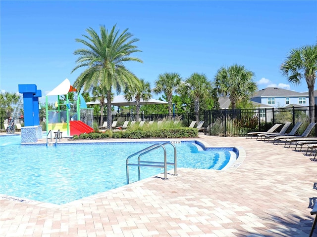 view of swimming pool featuring a patio area