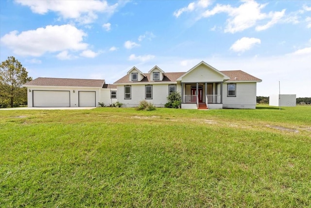 view of front of house featuring a front yard and a garage