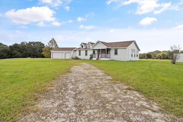 ranch-style house with a front lawn, a porch, and a garage