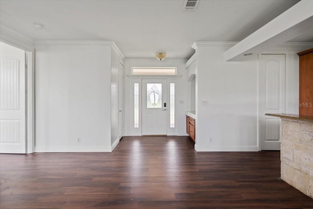 foyer featuring crown molding and dark hardwood / wood-style flooring