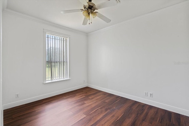 spare room featuring ceiling fan, ornamental molding, and dark wood-type flooring