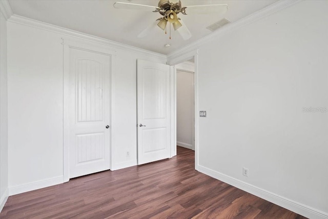 unfurnished bedroom featuring ornamental molding, dark hardwood / wood-style flooring, and ceiling fan