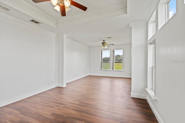 spare room featuring ceiling fan, dark hardwood / wood-style floors, and crown molding