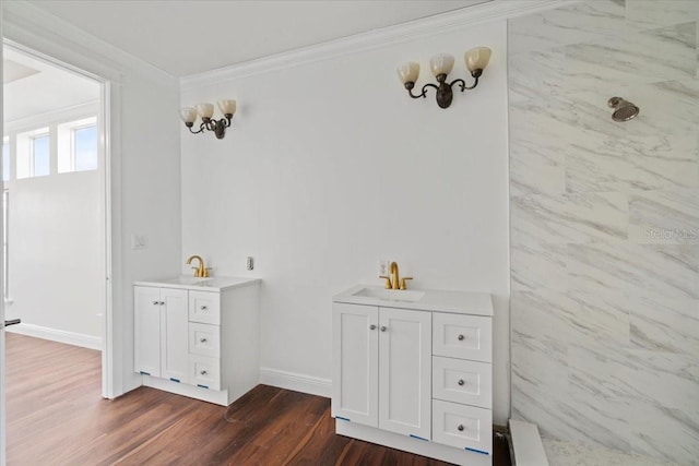 bathroom featuring wood-type flooring, crown molding, vanity, and a shower