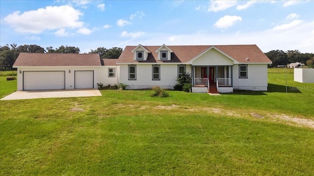 view of front of property with a garage and a front yard