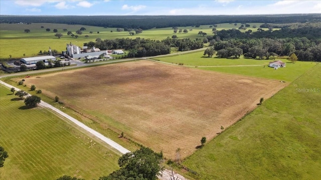 birds eye view of property featuring a rural view