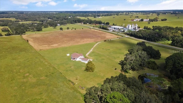 birds eye view of property with a rural view